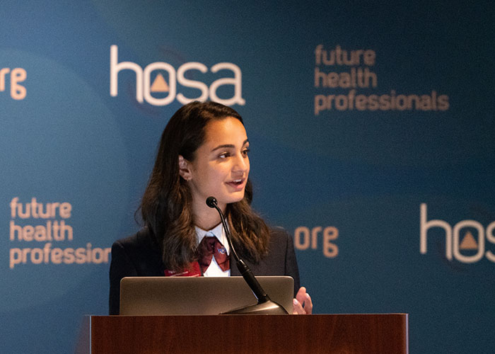 Woman speaking at a podium